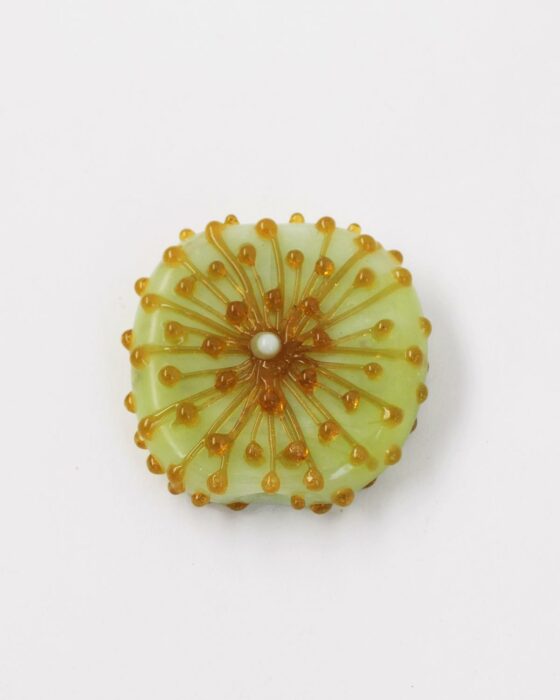 Handmade dandelion glass beads Amber on green