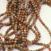 Unakite Round Beads 4mm. Natural gemstone has a mix of olive green , pink and red/orange hues.  Sold per strands, approx. 82 beads