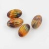 Creased oval resin beads 30x17mm. Sold per pack of 10