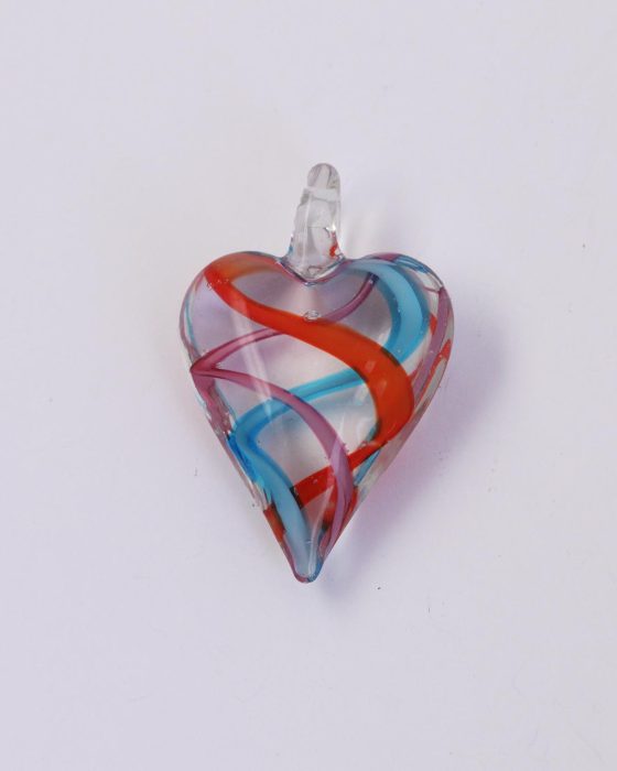 Glass heart pendant with red, blue and pink ribbons