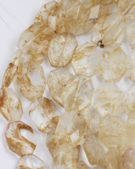 chuncky faceted glass bead rutilated quartz