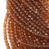 Faceted round glass bead 8mm dark amber
