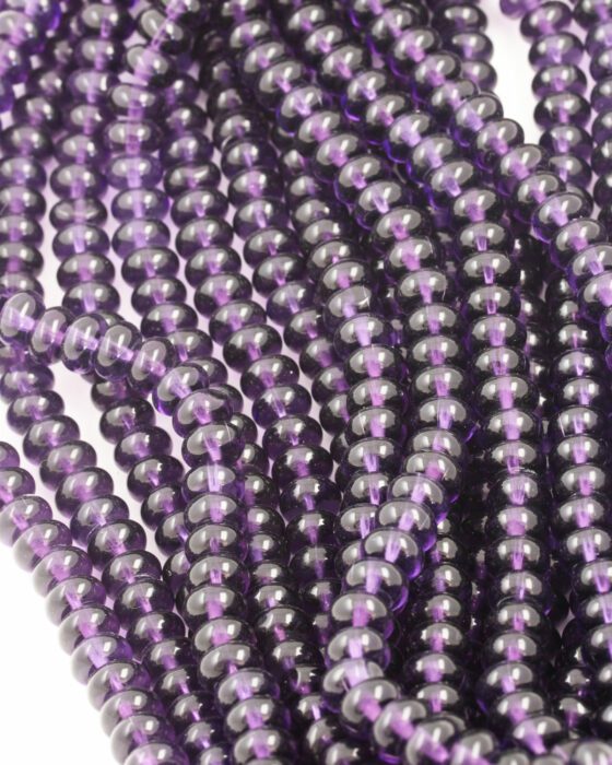 Disc Shape Glass Beads 7x11mm. Sold per strand approx 58 beads purple transparent