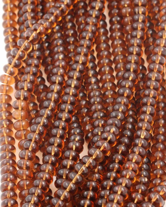 Disc Shape Glass Beads 7x11mm. Sold per strand approx 58 beads amber transparent