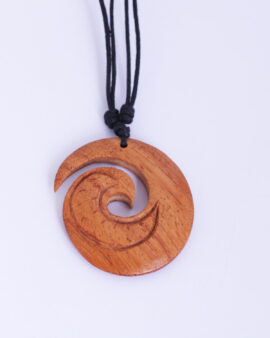 Carved wooden koru pendant